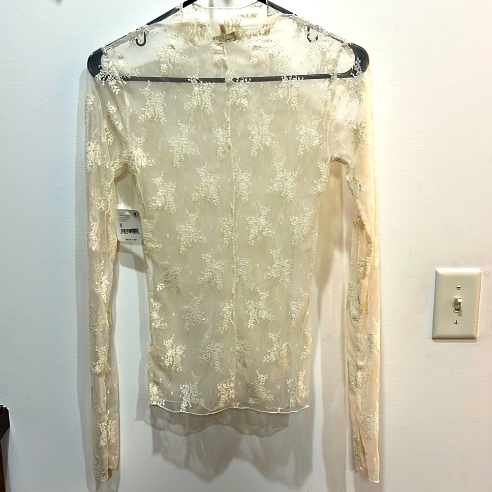 Free people lace top. NWT. No rips,tears, stains.